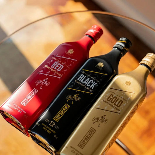 Buy Set Of Three Johnnie Walker 200 Years whisky bottles in red, black, and gold Online In Lebanon